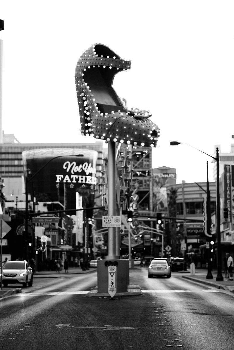 abbey, road sign, sky, photography, building exterior, symbol, avenue, monochrome, grayscale, downtown vega, light, clear sky, black and white, shoe, shoe sign
