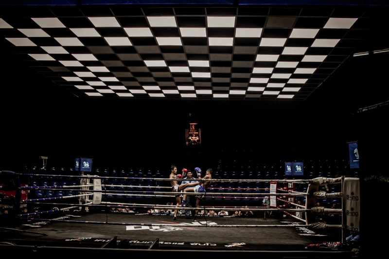 outdoors, man, red, sport, sign, box, boxer, boxing, celing, architecture, ceiling, full length, auto post production filter, standing, ring, one person