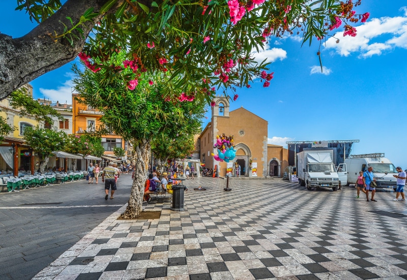 checkerboard, sicily, city, sky, pattern, van, cafe, building, women, adult, flowers, italy, island, 4K, day, piazza, tree, tables, taormina, real people