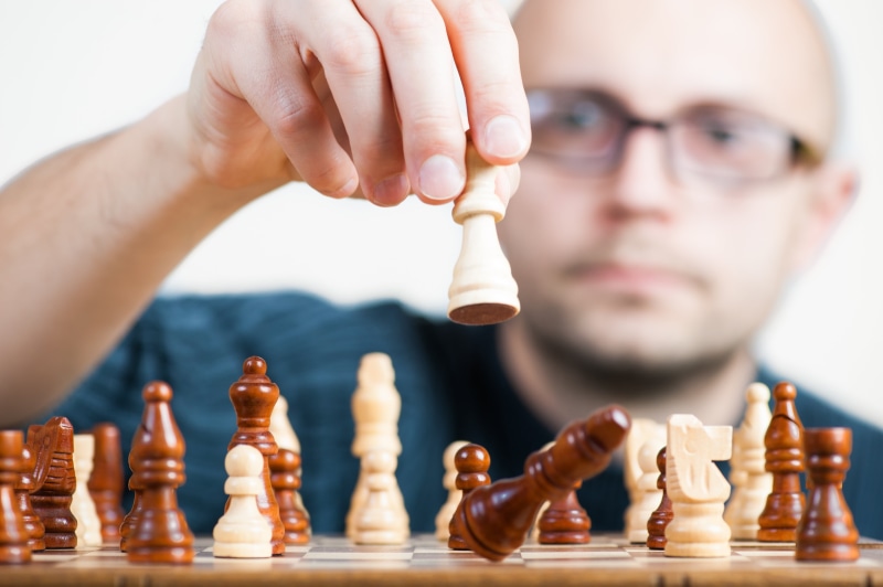planning, fun, competition, chess board, black, male, adult, win, queen, hand, the winner of the, checkerboard, people, strategic, keeps, pawn - chess piece