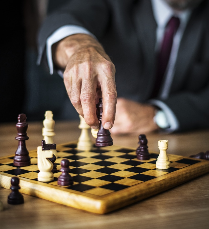 indoors, chessboard, strategy, 4K, moving, holding, relaxation, chess piece, intelligence, competition, focus, one person, hands, chess board, table, pieces