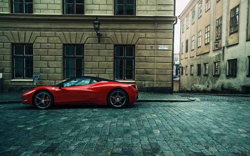 red, cobblestone, retro styled, motor vehicle, day, urban, window, land vehicle, stationary, architecture, mode of transportation, street, car, built structure