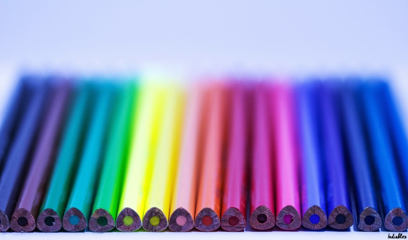focus on foreground, colored pencil, 5K, vibrant color, color, macro, multi colored, pens, writing instrument, coloring, side by side, rainbow, large group of objects