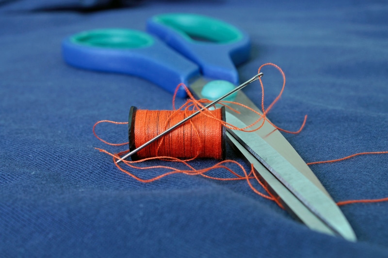 sewing Item, indoors, tape measure, needle, fashion, beside, tailor, line, material, spool, still life, craft, cloth, wool, scissor, needlecraft Product