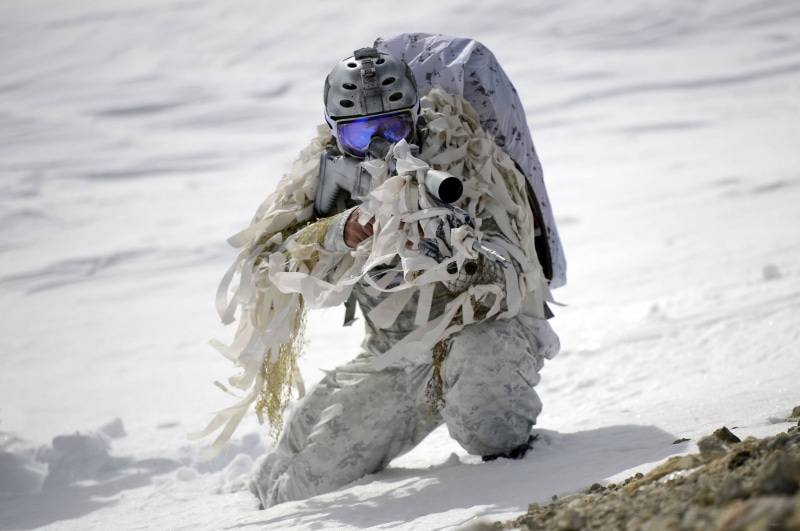 field, land, real people, nature, leisure activity, selective focus, sport, army, snowcapped mountain, focus on foreground, outdoors, clothing, people