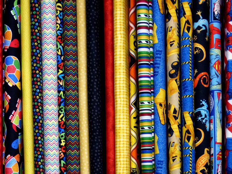 choice, designer fabric, large group of objects, full frame, market, textiles, textile, cotton, side by side, close-up, variation, no people, retail, fabric bolts