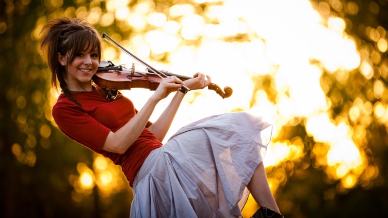 Lindsey Stirling, performance, musical instrument, music, gray, young adult, shirt, skill, child, smiling, teenager, arts culture and entertainment, playing