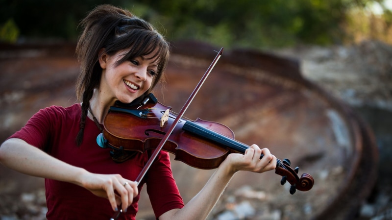 playing, violinist, one person, women, front view, holding, focus on foreground, 2K, Lindsey Stirling, string instrument, arts culture and entertainment