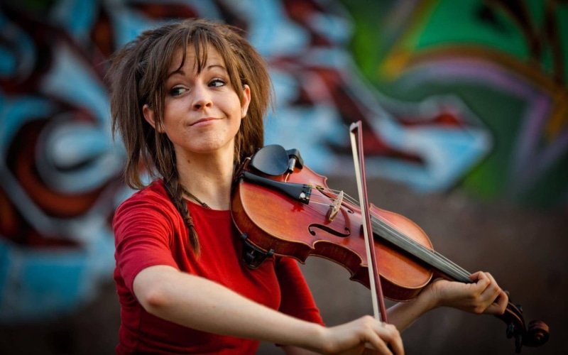 happiness, women, artist, violin, front view, females, adult, string instrument, violinist, arts culture and entertainment, music, hairstyle, skill, creativity