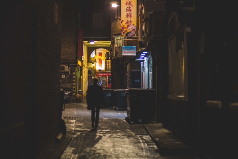 rear view, footpath, chinatown, night walk, built structure, building, one person, architecture, real people, leisure activity, city, incidental people