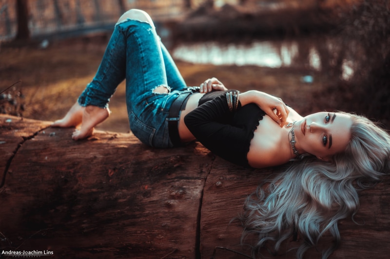 looking at camera, young women, young adult, adult, women, wood - material, hair, leisure activity, long hair, casual clothing, beautiful woman, torn jeans