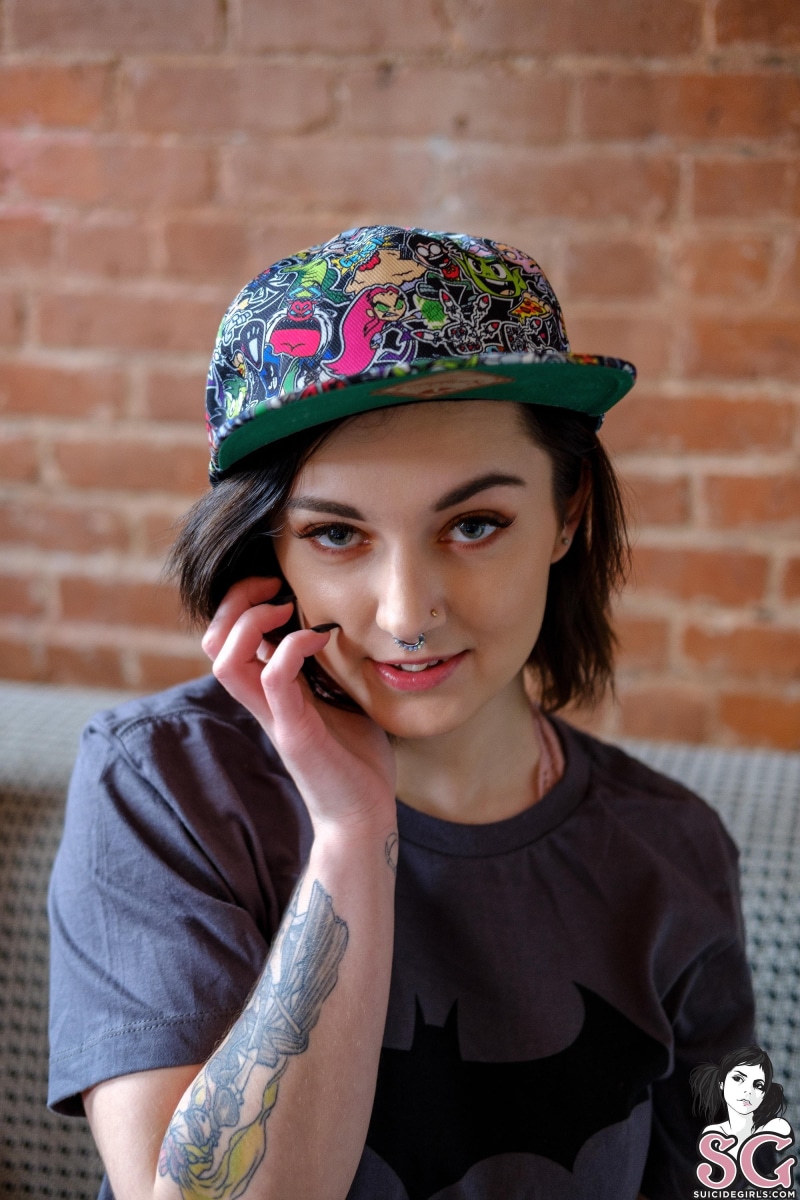 Batman logo, beautiful woman, baseball caps, hair, child, women indoors, model, brick, T-shirt, happiness, smiling, pierced septum, indoors, Teen Titans