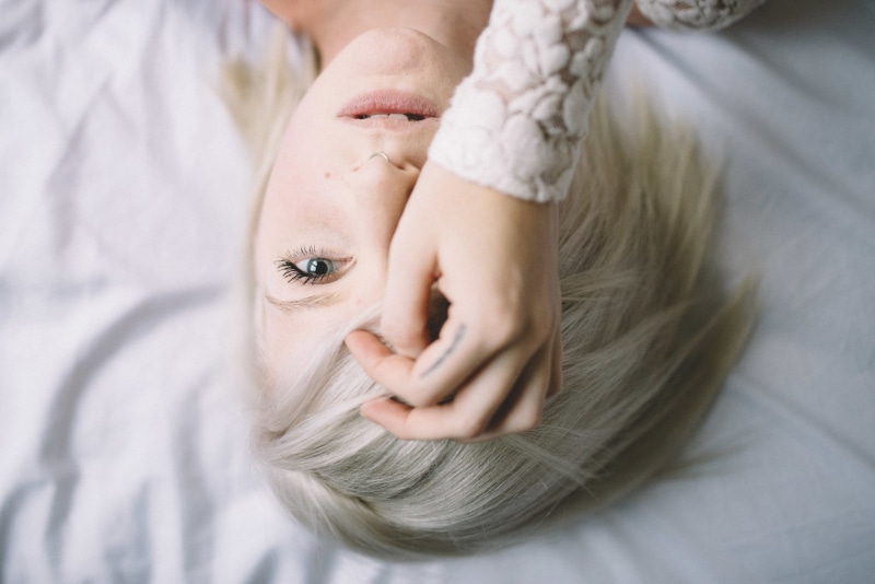 model, women indoors, hand on face, open mouth, 720P, short hair, face, gray eyes, blonde, pierced septum, women