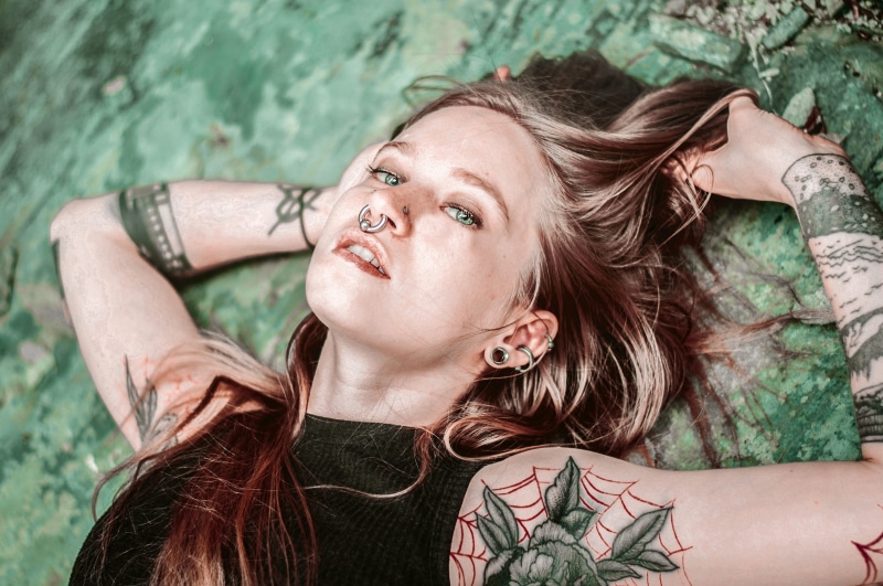 blond hair, headshot, long hair, women, hair, smile, tattooed woman, beautiful people, septum ring, lying on back, beauty, tattooed girl, walk, 4K, young adult