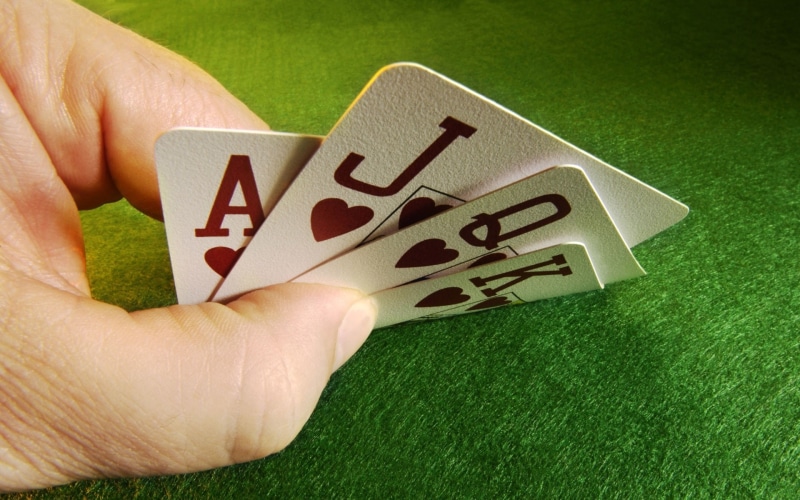 human finger, gambling, real people, opportunity, relaxation, luck, 1080P, green color, arts culture and entertainment, human hand, hand, leisure activity