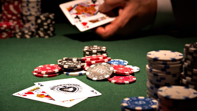 leisure activity, large group of objects, casino, arts culture and entertainment, human body part, nightlife, playing, luck, relaxation, hand, poker, green