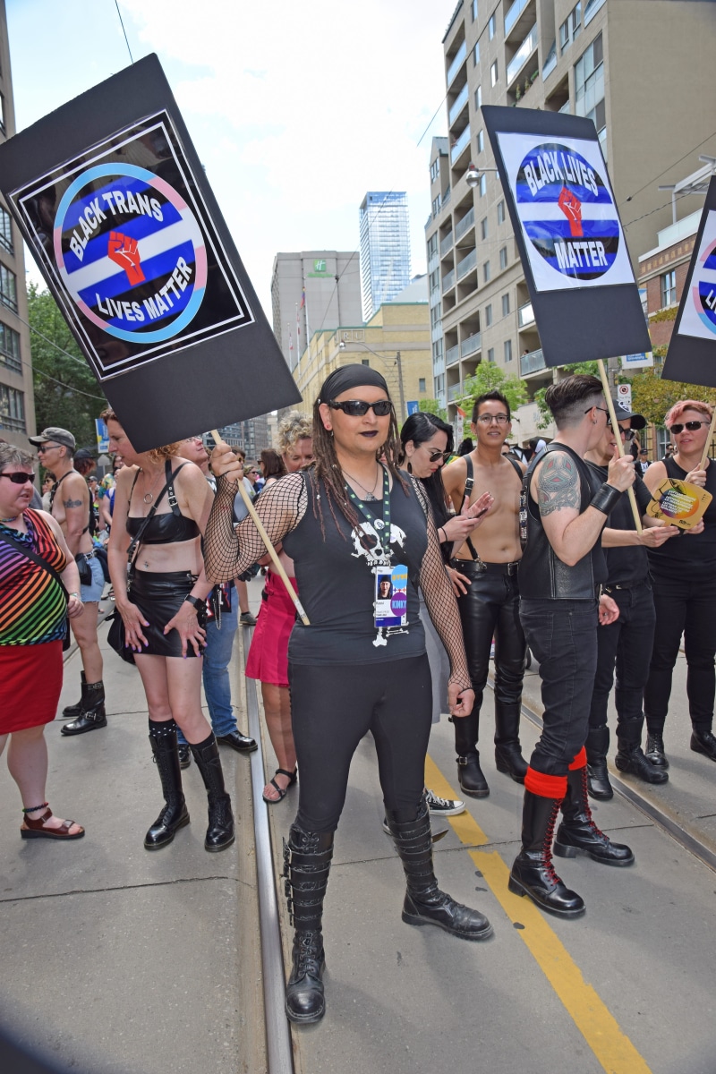 adult, standing, full length, road, lifestyles, placard, building exterior, toronto pride 2017, architecture, women, city, black lives matter, group of people