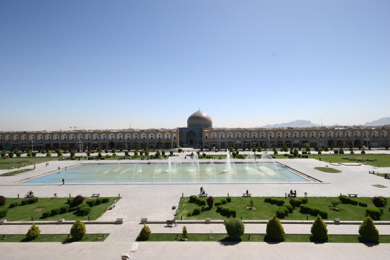 building, built structure, travel, history, sunlight, clear sky, Iran, tourism, outdoors, sky, green, memorial, brown, concrete, no people, the past, nature