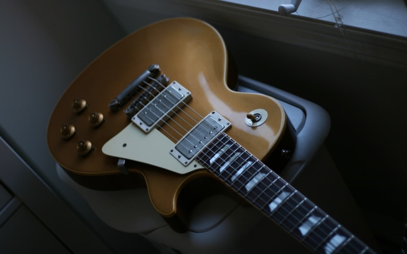 paul, day, string instrument, electric guitar, indoors, musical instrument, musical instrument string, guitar, equipment, connection, brown, high angle view