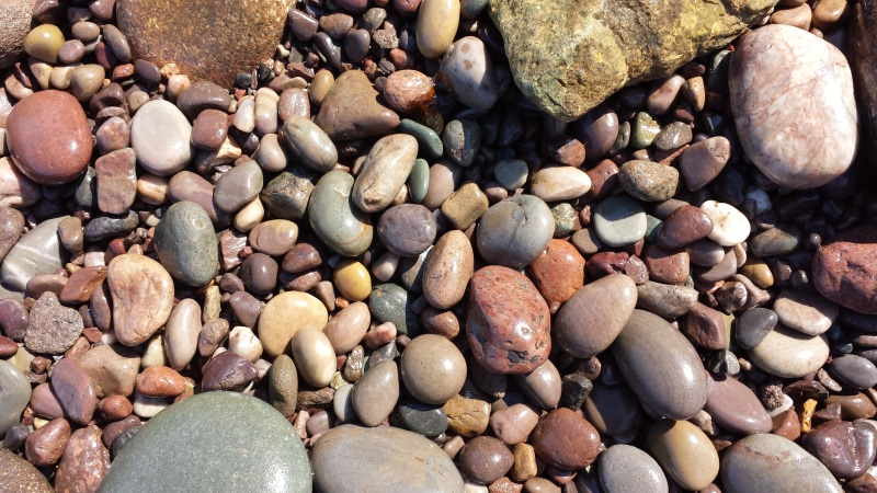 stone, land, backgrounds, beach, pebble, rock, assorted, pebbles, abundance, solid, textured, stones, rock - object, day, full frame, sunlight, high angle view