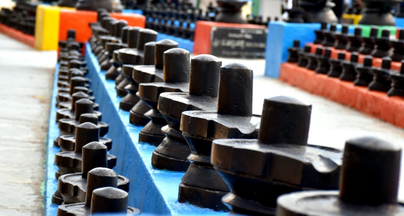 indoors, metal, selective focus, 5K, wood - material, karnataka, god, order, no people, choice, close-up, kotilingeshwara, shivalinga, repetition, india