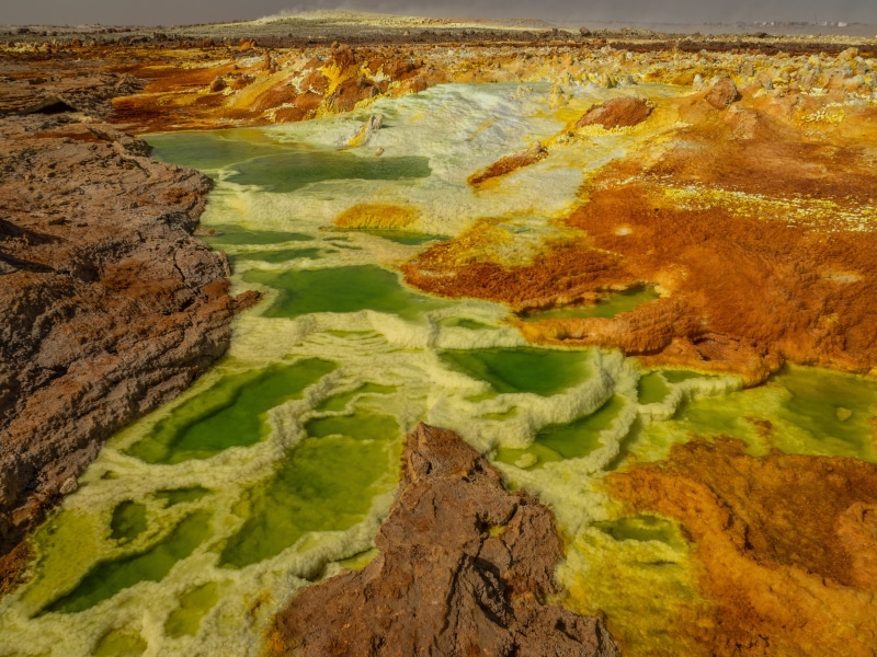 algae, beauty in nature, land, travel, environment, mountain, day, green color, ethiopia, danakil depression, mesa, high angle view, scenics - nature, art