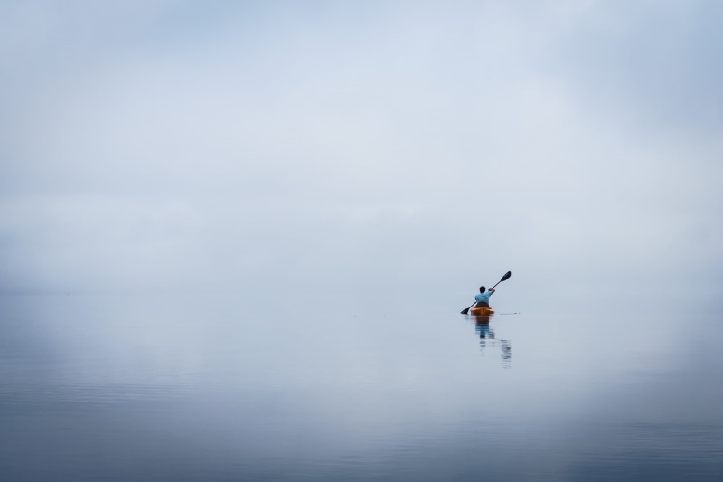 one person, horizon over water, sport, scenics - nature, outdoors, day, men, real people, canoes, horizon, non-urban scene, water, beauty in nature, reflection