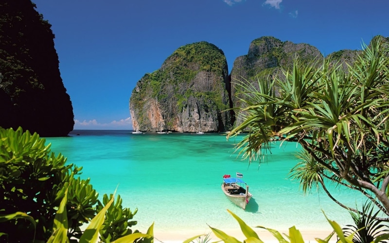 canoe, outdoors, solid, nautical vessel, landscape, rock, sunlight, white, plant, beauty in nature, no people, turquoise colored, water, bay, land, scenics - nature