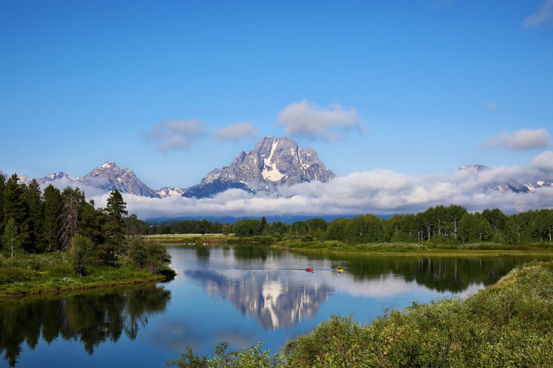 non-urban scene, landscape, mountain peak, waterfront, no people, tranquil scene, sky, lake, remote, outdoors, beauty in nature, boats, snowcapped mountain