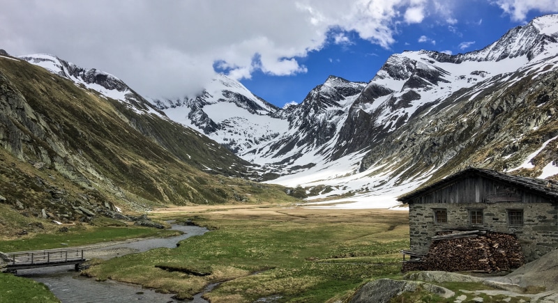 non-urban scene, mountain peak, beauty in nature, water, snow, snowcapped mountain, built structure, architecture, building, mountain, nature, outdoors