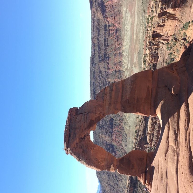 solid, tranquility, nature, blue, real people, beauty in nature, mountain, delicate arch trail, land, tranquil scene, rock, united states, moab, outdoors