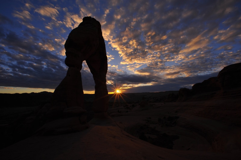 silhouette, sunset, 4K, leisure activity, united states, outdoors, arches, tranquility, scenics - nature, land, cloud - sky, moab, one person, delicate arch trail