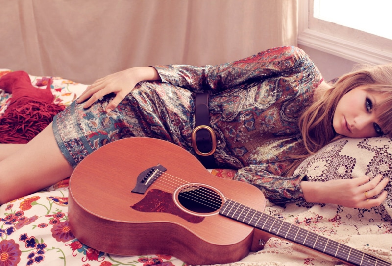floral pattern, hair, guitar, Taylor Swift, lying down, singer, sofa, domestic room, plucking an instrument, arts culture and entertainment, furniture