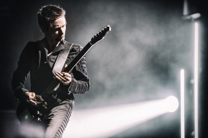 musical instrument, young men, stage, entertainment occupation, waist up, musician, one person, popular music concert, nightlife, music, concert, stage - performance space