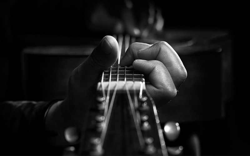 finger, musician, hands, guitar, human hand, person, one person, string, human body part, artist, monochrome, musical instrument, musical equipment, indoors