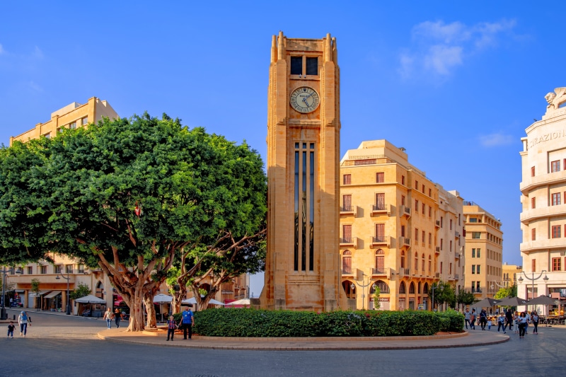 square, rolex, tree, tourism, plant, star, clock tower, cityscape, outdoors, street, clock, architecture, city life, city, 5K, blue, building, travel destinations