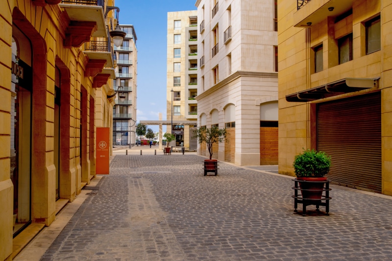 motor vehicle, alley, diminishing perspective, outdoors, lebanon, no people, the way forward, beirut, paved, car, potted plant, nature, footpath, street