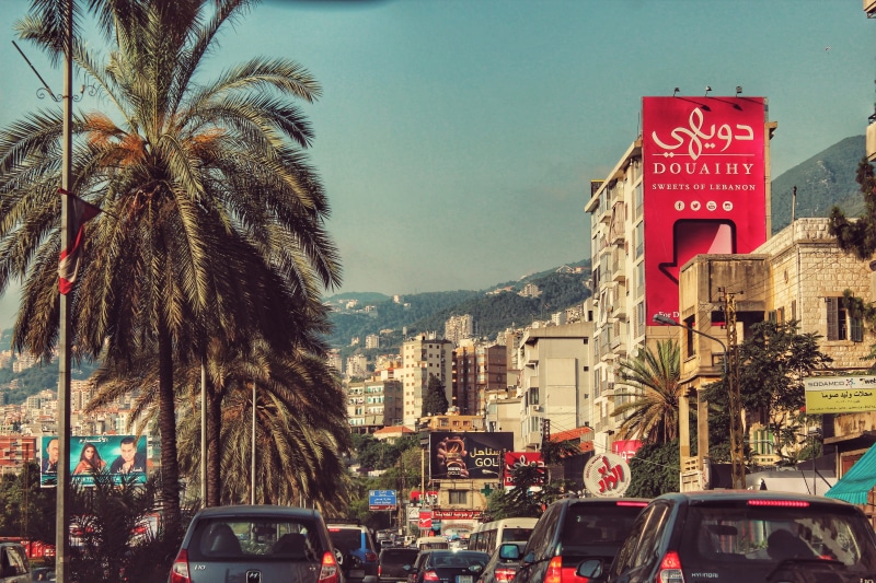 plant, transportation, text, city, city street, car, 4K, motor vehicle, traffic, building exterior, mode of transportation, street, lebanon, sign, land vehicle