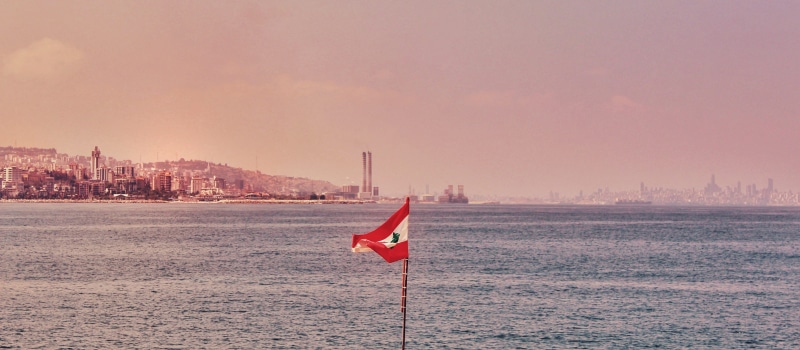 tabarja beach, office building exterior, travel destinations, sunset, cityscape, flag, city, building, nature, landscape, outdoors, sea, building exterior
