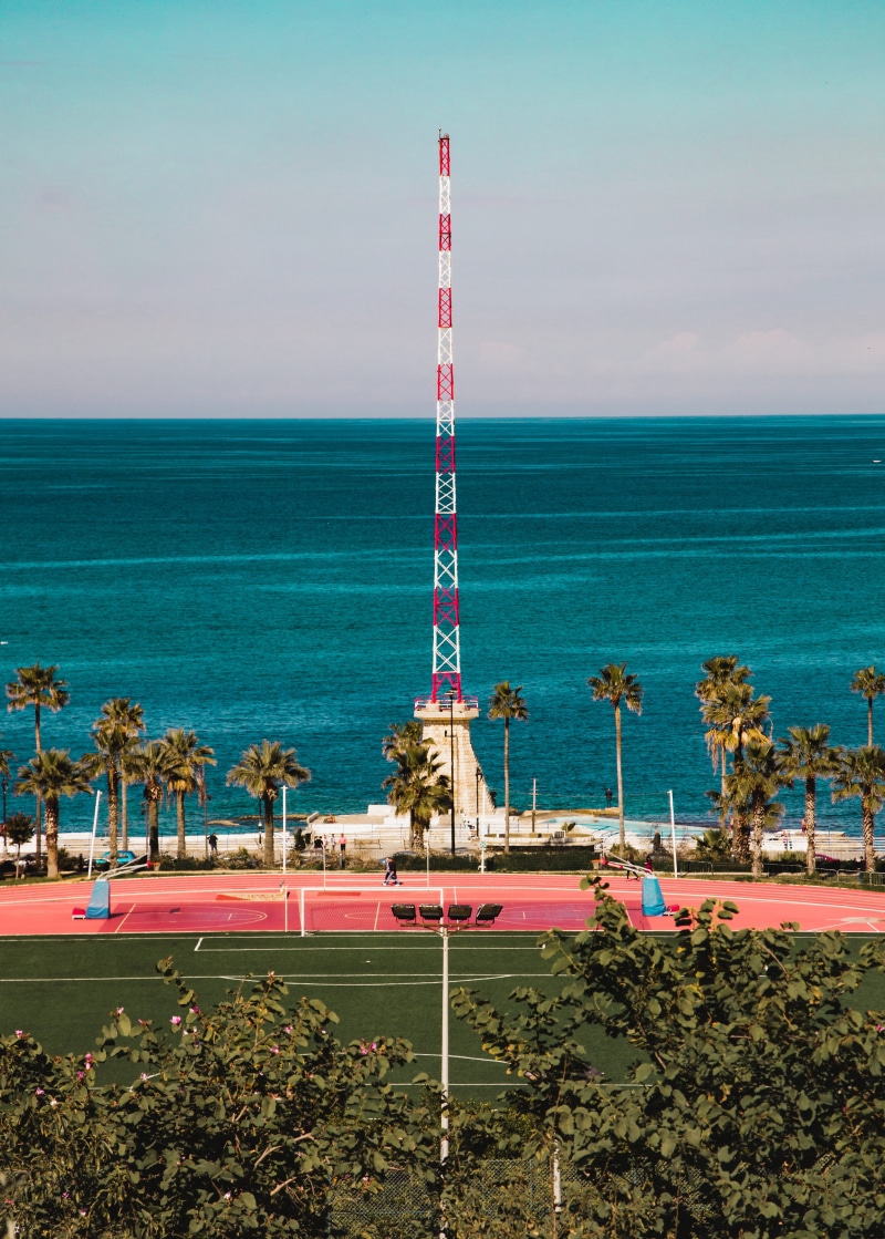 lebanon, palm, beauty in nature, cloud - sky, court, beach, tree, sky, horizon, land, pitch, basketball, tranquil scene, plant, resort, day