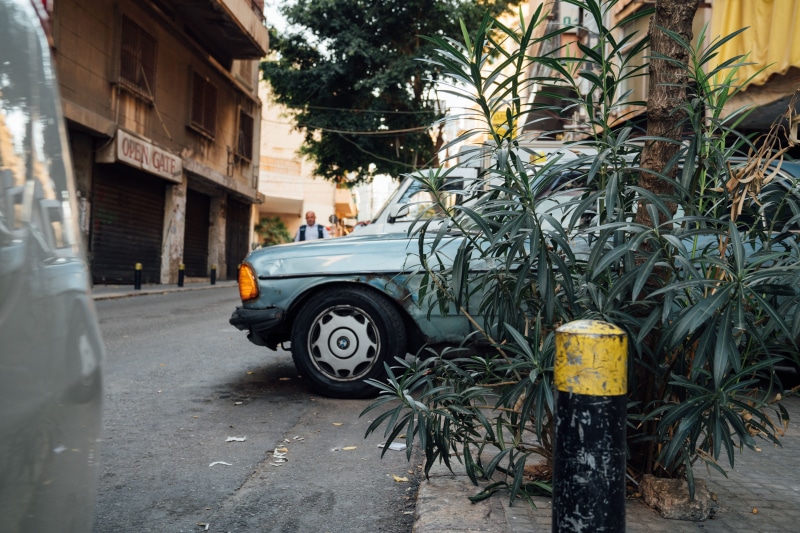 automobile, land vehicle, wheel, transportation, tarmac, lebanon, yellow, 2K, no people, day, person, building, tree, city, alloy wheel, road, building exterior