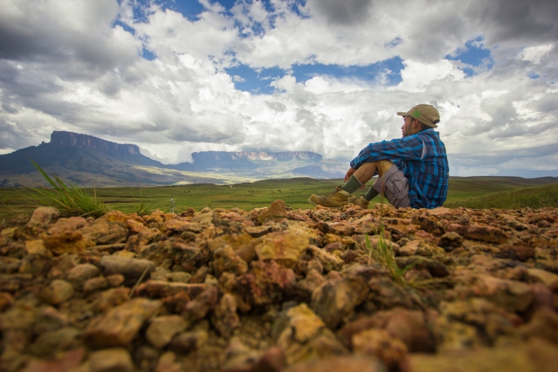 real people, outdoors, tranquil scene, lifestyles, environment, leisure activity, scenics - nature, rock, tranquility, men, non-urban scene, mount roraima