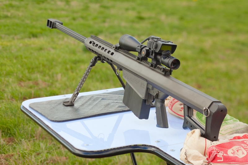 transportation, 720P, no people, field, mode of transportation, outdoors, rifle, land vehicle, black, plant, the rifle, grass, barrett m82, weapon, gun