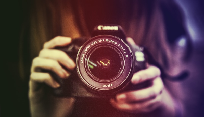 occupation, photographing, technology, camera - photographic equipment, one person, photographer, vintage, activity, holding, hand, photographic equipment
