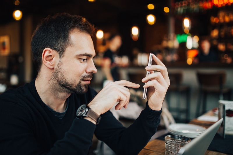 people, focus on foreground, telephone, handsome, male, adults Only, busy, males, macbook, wireless technology, only Men, connection, typing, adult, businessman