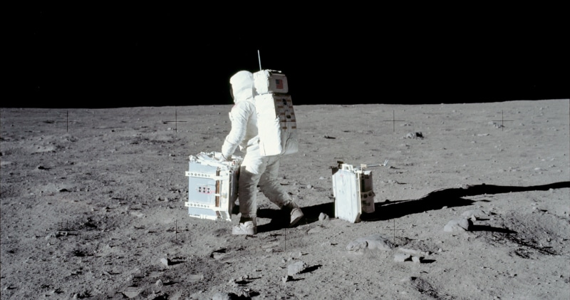 human representation, astronaut, sky, beach, land, Apollo, space, shadow, white, desert, outdoors, the past, building, history, full length, concrete, day