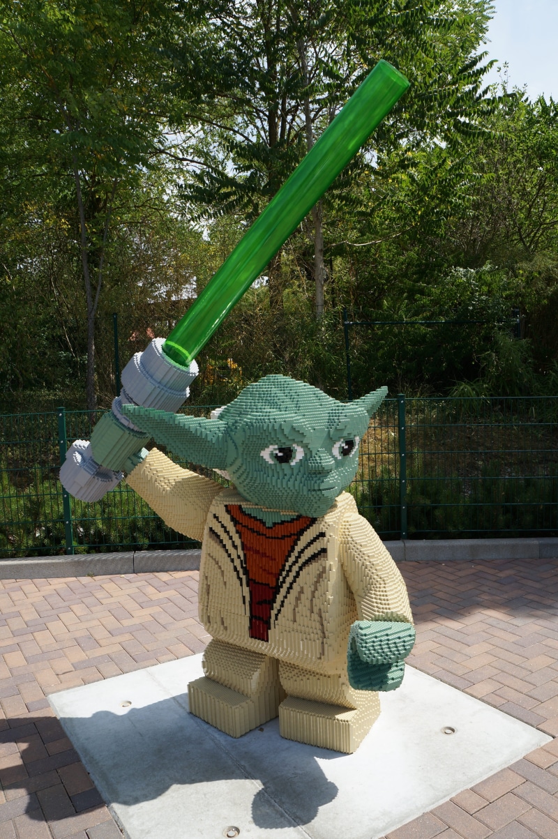 Jedi, laser sword, no people, from lego, day, green color, outdoors, sunlight, Yoda, plant, outdoor play equipment, shadow, 4K, statue, Star Wars, Lego