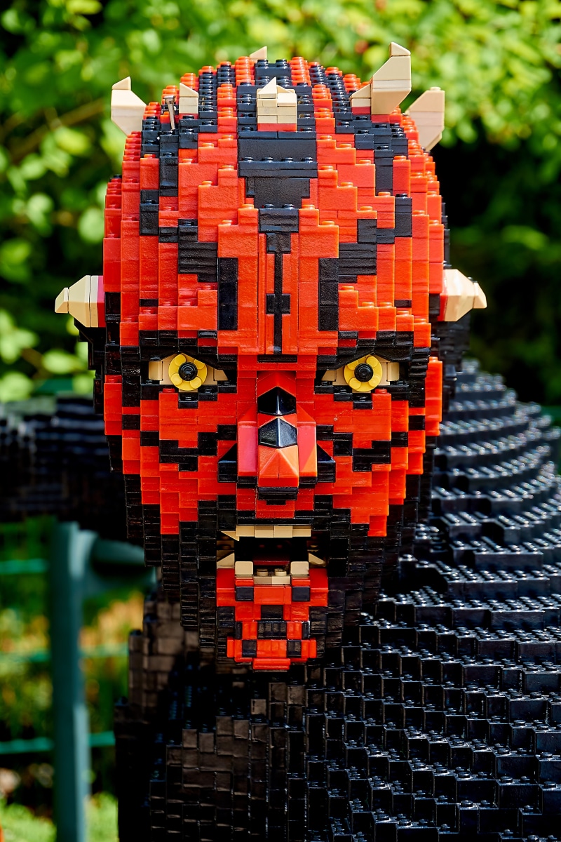 children, religion, orange color, legoland, place of worship, communication, theme park, red, selective focus, 5K, play, day, focus on foreground, weapons