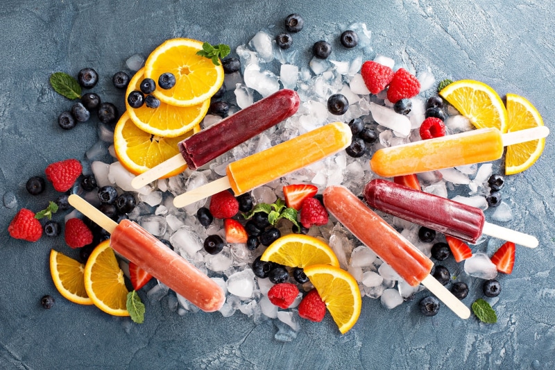 strawberries, food and drink, indoors, blackberries, orange, fruit, cold temperature, high angle view, orange (fruit), orange color, temptation, citrus fruit