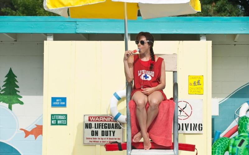 one person, casual clothing, front view, lifestyles, sitting, popsicle, beautiful woman, young women, red, leisure activity, sunglasses, communication
